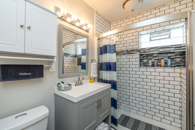Tiled bathroom with a walk-in shower